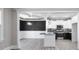 Eat-in kitchen with white cabinets, granite countertops, and stainless-steel appliances at 115 S Harper Faith Way, Benson, NC 27504