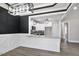 White and black kitchen includes granite countertops and white cabinetry at 115 S Harper Faith Way, Benson, NC 27504