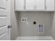 Utility room with overhead cabinets, and washer dryer hookups at 115 S Harper Faith Way, Benson, NC 27504