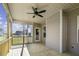 Relaxing screened porch with ceiling fan, wood flooring, and views of the backyard at 115 S Harper Faith Way, Benson, NC 27504