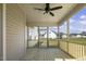 Inviting screened porch with ceiling fan, wood floors, and views of the backyard at 115 S Harper Faith Way, Benson, NC 27504