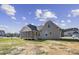 Charming house with a screened porch and neutral siding at 115 S Harper Faith Way, Benson, NC 27504