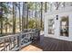 Spacious wooden deck with a view of the wooded backyard, providing a relaxing outdoor space at 116 Lakeshore Dr, Durham, NC 27713
