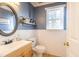 Stylish half bathroom features a vanity with a sink and modern fixtures at 116 Lakeshore Dr, Durham, NC 27713