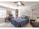 Cozy bedroom featuring a bed, desk, ceiling fan, and natural light, offering a comfortable retreat at 116 Lakeshore Dr, Durham, NC 27713