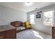 Comfortable bedroom with natural light from two windows at 116 Lakeshore Dr, Durham, NC 27713