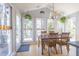 Bright dining room featuring hardwood floors, large windows, and natural light at 116 Lakeshore Dr, Durham, NC 27713