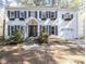 Inviting two-story home with dark shutters and blooming window boxes at 116 Lakeshore Dr, Durham, NC 27713