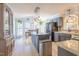 Spacious kitchen with island, pendant lighting, and stainless steel appliances at 116 Lakeshore Dr, Durham, NC 27713