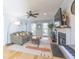 Comfortable living room with a fireplace, hardwood floors, and a cozy couch at 116 Lakeshore Dr, Durham, NC 27713