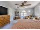 Serene main bedroom featuring a ceiling fan, window and comfortable furnishings at 116 Lakeshore Dr, Durham, NC 27713