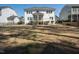 Back exterior view of the home that shows the backyard, porch and patio at 117 Gravel Brook Ct, Cary, NC 27519