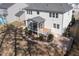Aerial shot of a backyard featuring a lawn, screened porch, patio, and meticulous landscaping at 117 Gravel Brook Ct, Cary, NC 27519