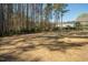 Large backyard with tall trees in the background at 117 Gravel Brook Ct, Cary, NC 27519