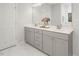 Contemporary bathroom with double sink vanity and grey cabinets at 117 Gravel Brook Ct, Cary, NC 27519