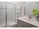 Modern bathroom featuring a glass-enclosed shower, vanity, and neutral-colored decor at 117 Gravel Brook Ct, Cary, NC 27519