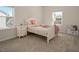 Cozy bedroom with ample sunlight, neutral walls, and carpet flooring at 117 Gravel Brook Ct, Cary, NC 27519