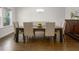 Elegant dining room with modern furniture and hardwood floors at 117 Gravel Brook Ct, Cary, NC 27519