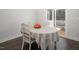 Inviting dining area featuring a table with a tablecloth and access to the outdoor patio at 117 Gravel Brook Ct, Cary, NC 27519