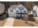 A beautiful two-story home with a well-manicured lawn, attached garage, and lovely front porch at 117 Gravel Brook Ct, Cary, NC 27519
