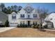 Charming two-story home featuring a manicured lawn and an attached two-car garage at 117 Gravel Brook Ct, Cary, NC 27519