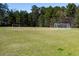 A lush green field with soccer goals for outdoor recreation and sports activities at 117 Gravel Brook Ct, Cary, NC 27519