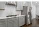 Well-equipped kitchen featuring stainless steel appliances, a range hood, and ample counter space at 117 Gravel Brook Ct, Cary, NC 27519