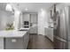 Modern kitchen with stainless steel appliances and a large center island at 117 Gravel Brook Ct, Cary, NC 27519