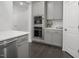 Modern kitchen boasts gray cabinetry, stainless steel appliances, and a stylish countertop at 117 Gravel Brook Ct, Cary, NC 27519