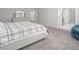 Bright bedroom featuring neutral walls, carpet flooring, and ensuite bath and walk-in closet at 117 Gravel Brook Ct, Cary, NC 27519