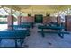 A picnic pavilion with multiple tables and brick pillars offering an outdoor space for gathering at 117 Gravel Brook Ct, Cary, NC 27519