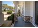Inviting front porch with stone supports and a dark grey painted floor at 117 Gravel Brook Ct, Cary, NC 27519