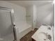 Clean bathroom featuring a bathtub and shower, with double sinks at 11700 Coppergate Dr # 105, Raleigh, NC 27614