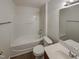 Bathroom with a tub and shower combo and wood-look floors at 11700 Coppergate Dr # 105, Raleigh, NC 27614