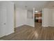 Open-concept living area with hardwood floors seamlessly connects to the kitchen at 11700 Coppergate Dr # 105, Raleigh, NC 27614
