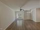 Spacious living area with hardwood floors, ceiling fan and lots of natural light at 11700 Coppergate Dr # 105, Raleigh, NC 27614