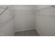 Spacious walk-in closet with wire shelving for ample storage at 11700 Coppergate Dr # 105, Raleigh, NC 27614