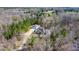 Beautiful home surrounded by lush greenery with a circular driveway and attached garage at 119 Cardinal Crest Ct, Pittsboro, NC 27312