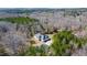 Spacious home with a circular driveway surrounded by beautiful landscaping and trees at 119 Cardinal Crest Ct, Pittsboro, NC 27312