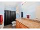 Bathroom features a granite countertop, ample vanity storage space and tiled floor at 119 Cardinal Crest Ct, Pittsboro, NC 27312
