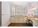 Bathroom vanity area with granite countertop, custom cabinets, and plantation shutters at 119 Cardinal Crest Ct, Pittsboro, NC 27312