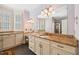 Elegant bathroom featuring granite countertops, custom cabinetry, and a large vanity area at 119 Cardinal Crest Ct, Pittsboro, NC 27312