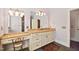 Spacious bathroom vanity featuring granite countertops, custom cabinets, and a large mirror at 119 Cardinal Crest Ct, Pittsboro, NC 27312