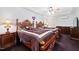 Cozy bedroom featuring two wooden beds with elegant bedding and recessed lighting at 119 Cardinal Crest Ct, Pittsboro, NC 27312