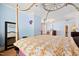 A beautiful bedroom with a canopy bed and an assortment of decor and natural light at 119 Cardinal Crest Ct, Pittsboro, NC 27312