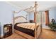 Bright bedroom featuring a canopy bed, soft blue walls, and a cozy, inviting atmosphere at 119 Cardinal Crest Ct, Pittsboro, NC 27312