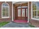 Elegant front entrance features arched windows and beautiful double doors at 119 Cardinal Crest Ct, Pittsboro, NC 27312