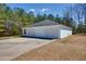 Detached three-car garage with ample parking space in driveway at 119 Cardinal Crest Ct, Pittsboro, NC 27312