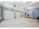 The spacious garage offers plenty of room for vehicles and storage, with three garage doors at 119 Cardinal Crest Ct, Pittsboro, NC 27312