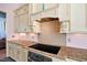Bright kitchen featuring custom cabinetry, granite countertops, and stainless steel appliances at 119 Cardinal Crest Ct, Pittsboro, NC 27312